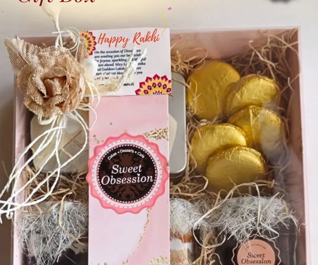 For Raksha Bandhan, I create these special gift boxes filled with a curated selection of sweets. This hamper includes jar desserts, assorted chocolates, and a beautiful Rakhi, all elegantly packaged to celebrate the sibling bond.