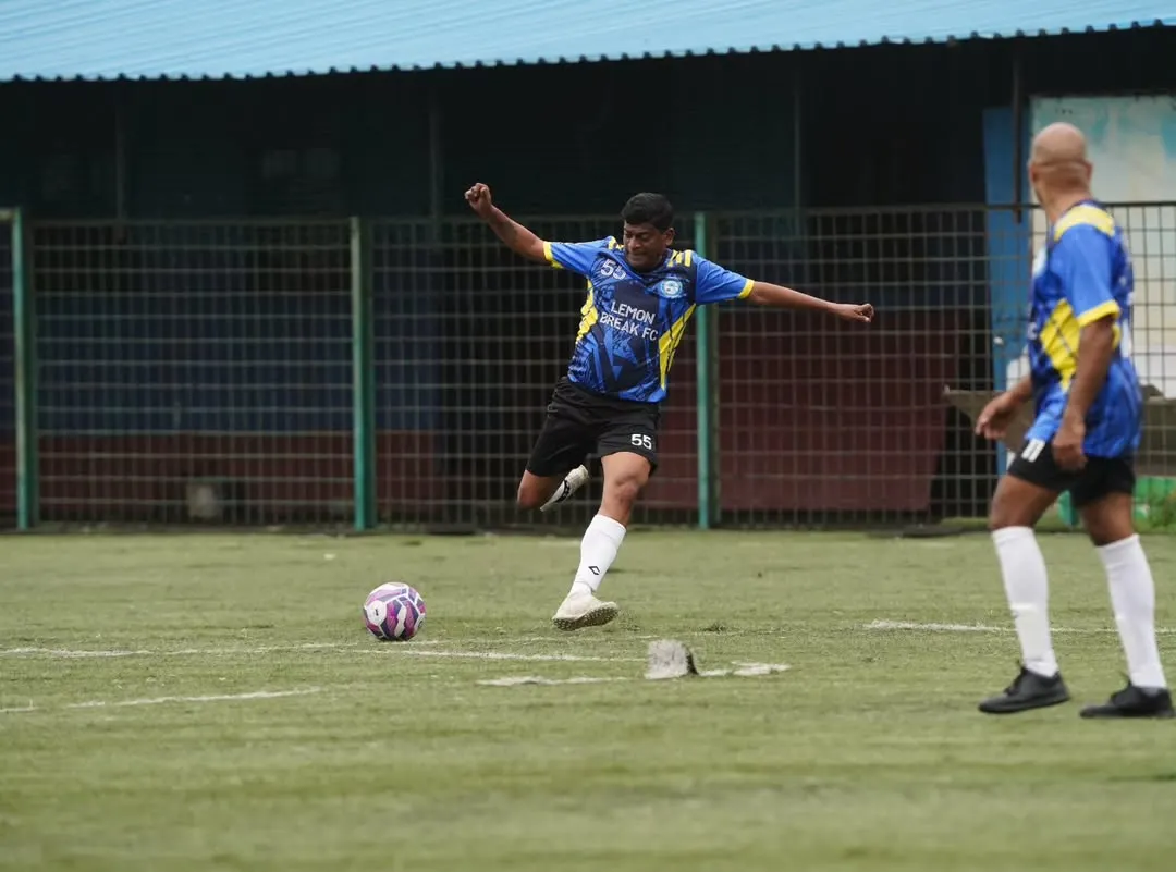 A player unleashes a powerful shot during a competitive league match. We play with full intensity, proving that passion for football has no age limit.
