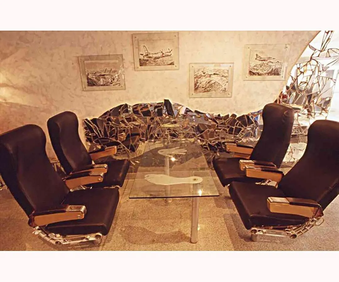 This is where imagination takes flight. We transformed salvaged aircraft wreckage into the Aste Bar, using actual passenger seats and fuselage parts to create a truly unique and immersive experience.