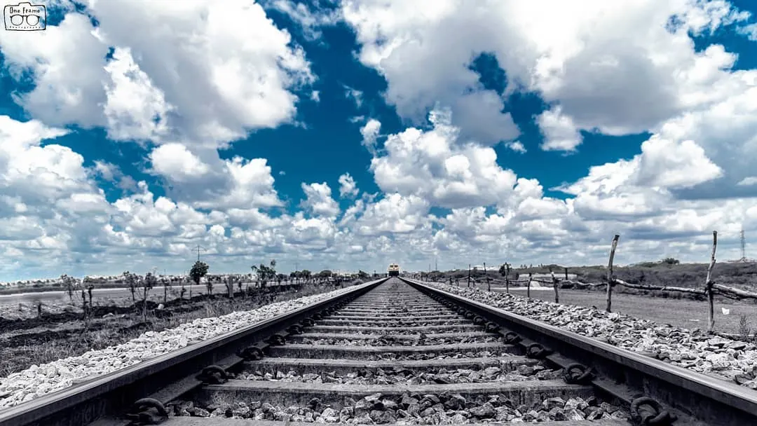 Composition is all about telling a story. Here, I used the railway tracks as 'leading lines' to draw your eye into the distance. We'll explore how to find and use these lines in landscapes and cityscapes to create powerful, dynamic images. I also applied a selective color effect in editing to make the sky pop.