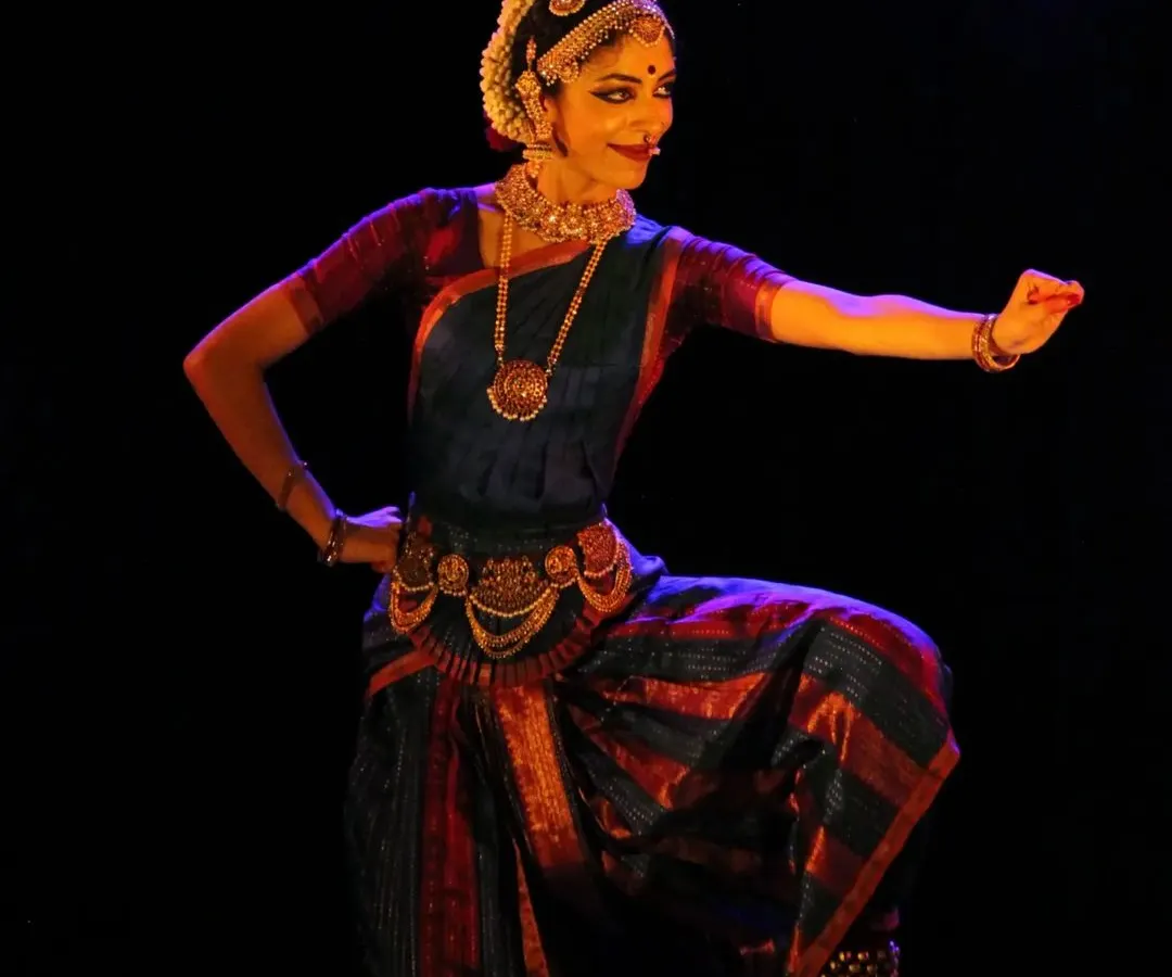 A moment of complete surrender, or 'Shringara Sharanagati', from a recent performance. This pose captures the essence of devotion that I strive to embody in my dance and impart to my students in our Bharatanatyam classes. It represents the core of my artistic expression.