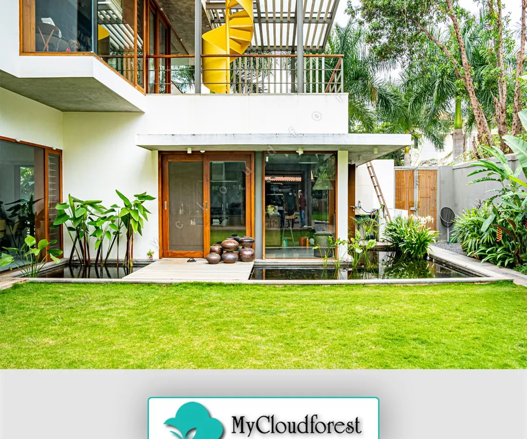 I designed this space to seamlessly blend modern architecture with the natural environment. The clean lines of the home are softened by a pristine lawn and a tranquil water feature, creating a private retreat that feels both sophisticated and serene.