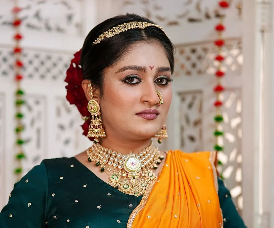 A modern take on the traditional Peshwai look. I focused on creating a flawless, radiant base and defining the eyes to complement the classic Maharashtrian jewelry and vibrant saree.