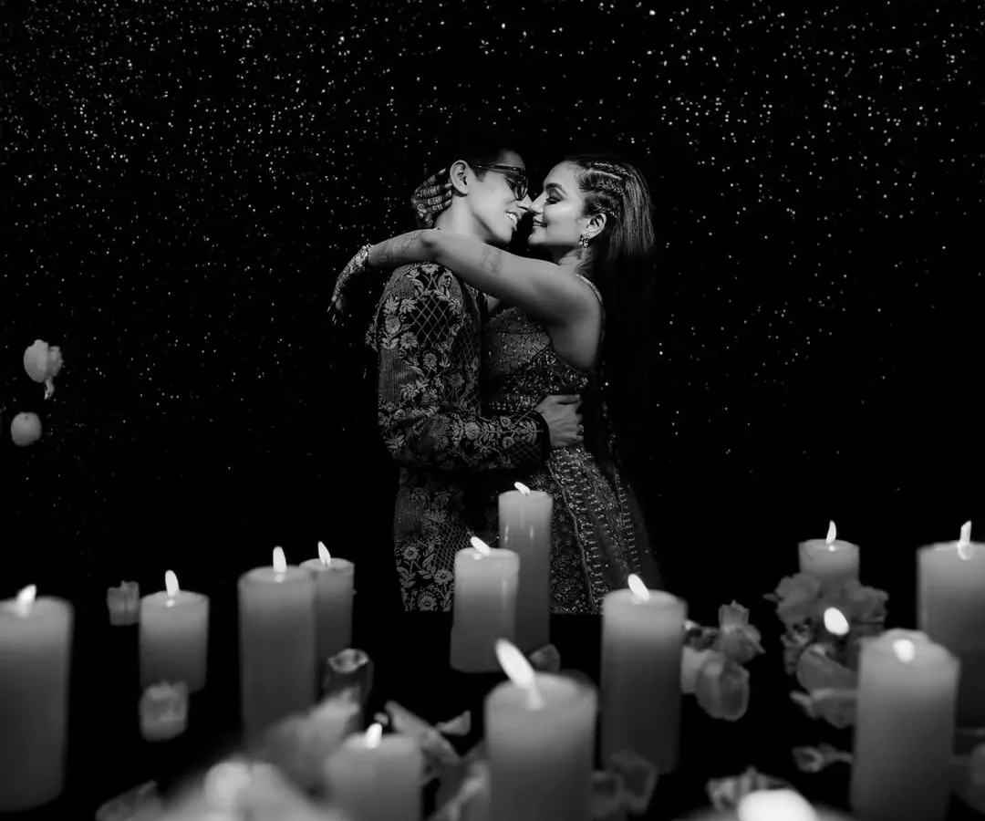 Surrounded by candlelight, this intimate black and white portrait from a Sangeet night captures the quiet romance amidst the celebration. I use dramatic lighting to create such fine art moments.