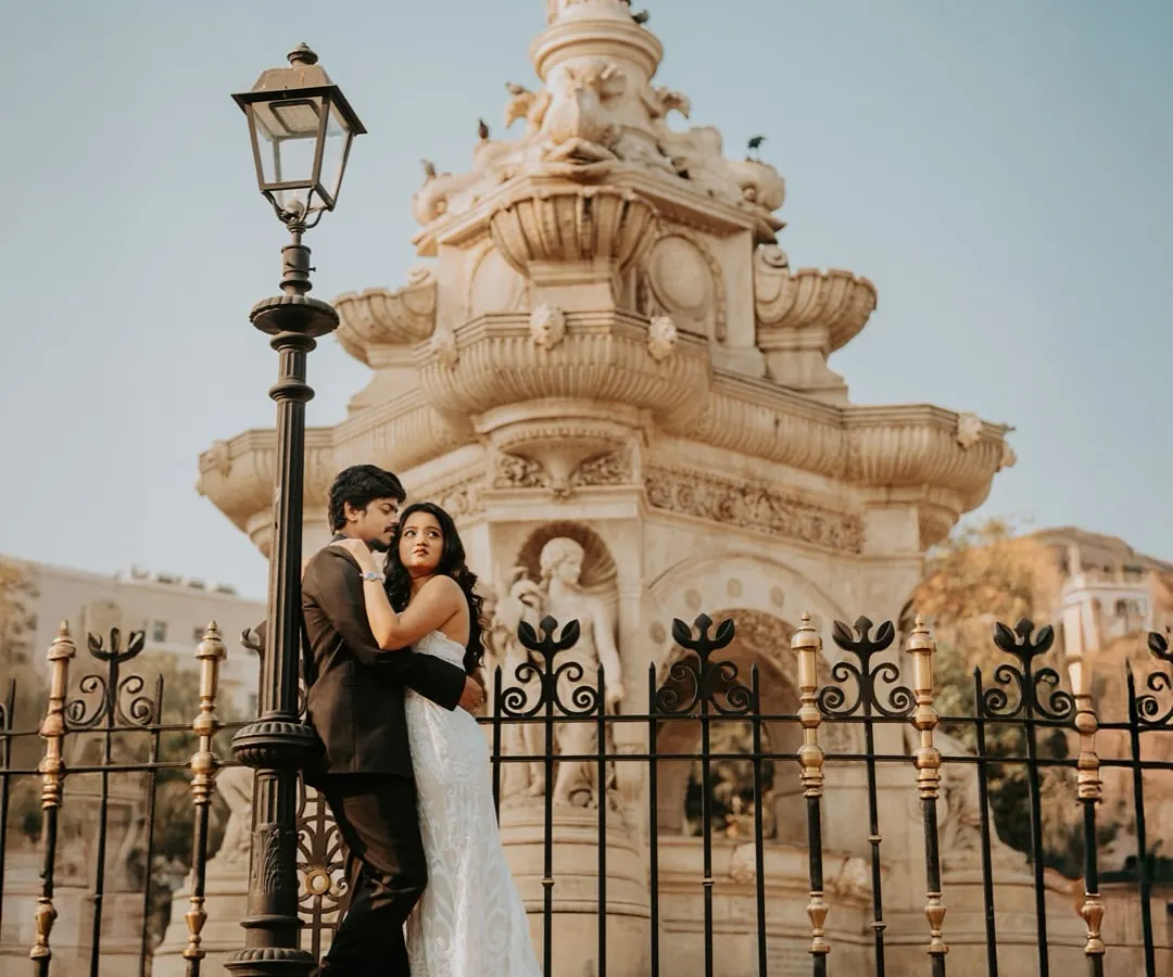 Framing love against the iconic Flora Fountain in South Mumbai. I use the city's stunning architecture to create dramatic and elegant pre-wedding portraits that have a classic, cinematic feel.