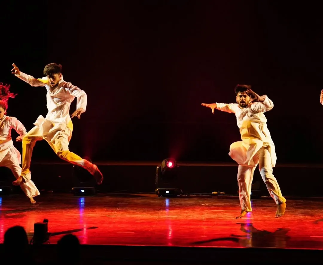This is the kind of energy we bring to the stage. A powerful, synchronized performance from our "Inquilab" production, this image showcases the dynamic and expressive choreography we create for men's group dances, perfect for a groom's squad or family performance.