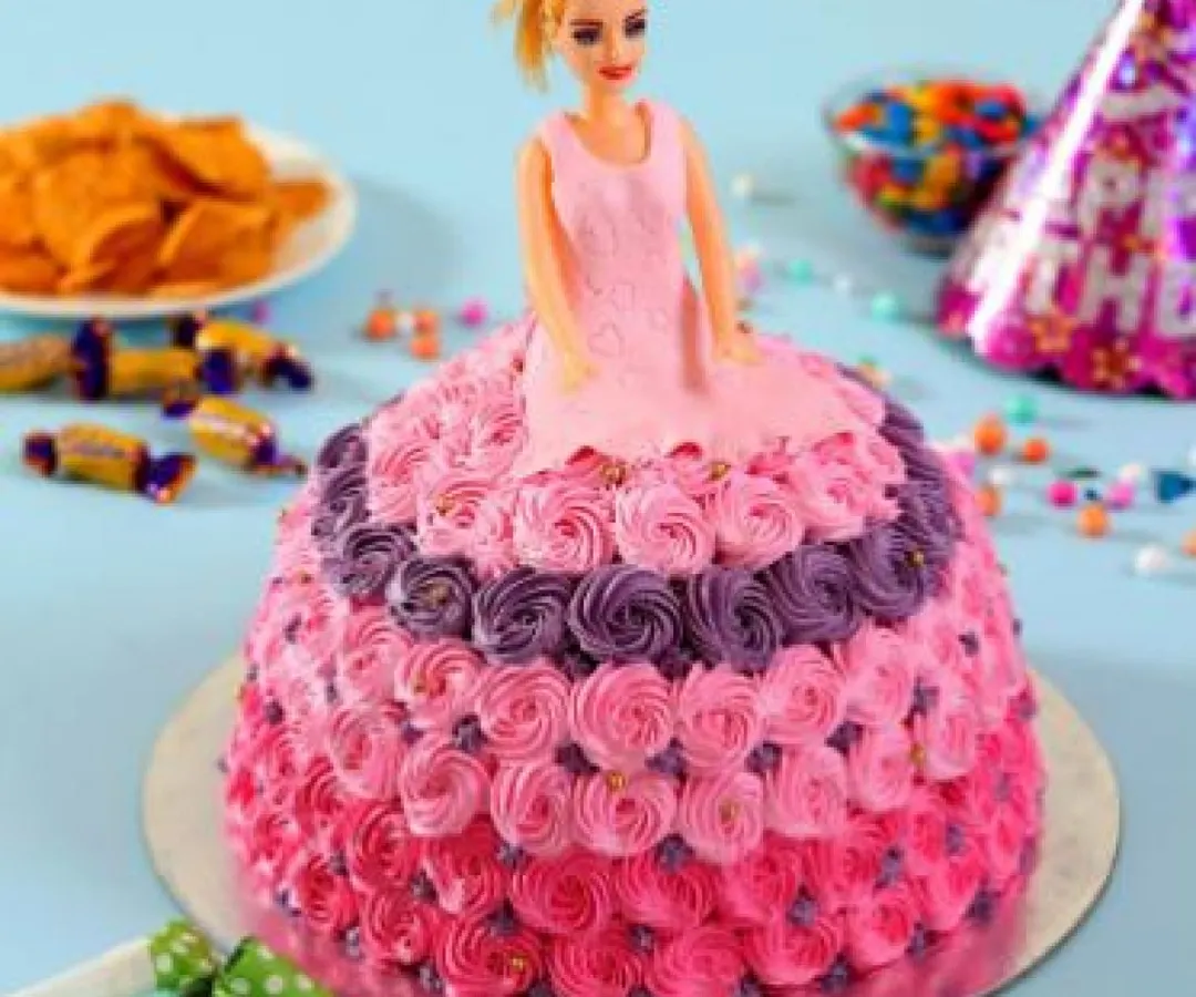 Make your child's birthday magical with a stunning Barbie doll cake. This design features intricate rosette piping and is a guaranteed centerpiece for any kids' party. We can customize the colours and flavour to your liking.
