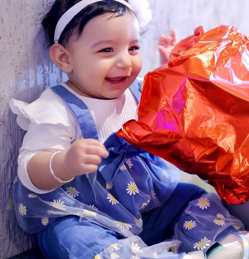 A candid portrait of the birthday girl sharing a joyful smile. I love capturing the sweet, fleeting moments of childhood during kids' birthday photoshoots.