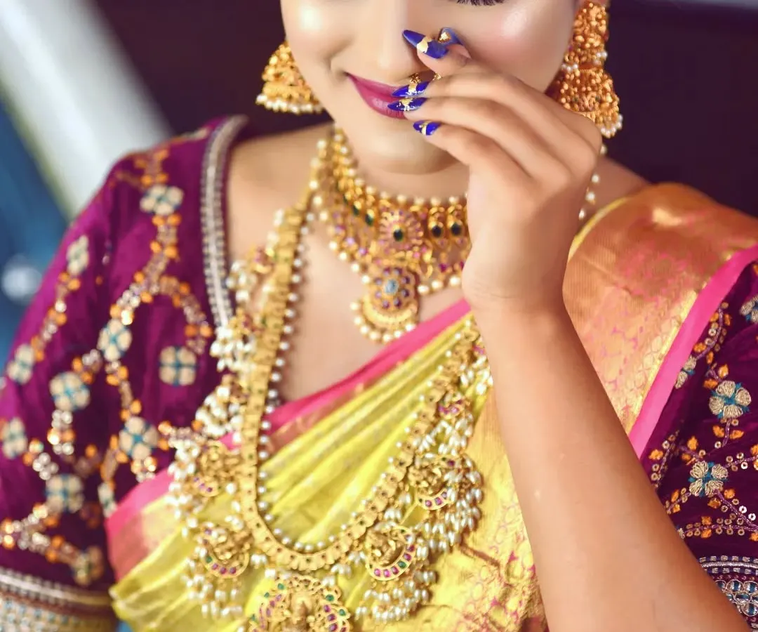 A close up of this beautiful bride's final look. I used a soft, natural HD makeup technique with a pop of color on the eyes to complement her gorgeous silk saree. Notice the details, from the perfectly blended eyeshadow to the sharp winged eyeliner and the elegant nail art.