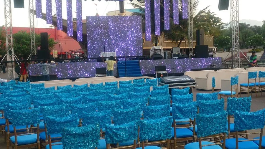 For a Sangeet that leaves a lasting impression, we designed this massive stage in Lonavala, complete with professional trussing, dynamic lighting, and a huge LED screen. We handle large-scale resort wedding coordination to ensure a high-impact experience.