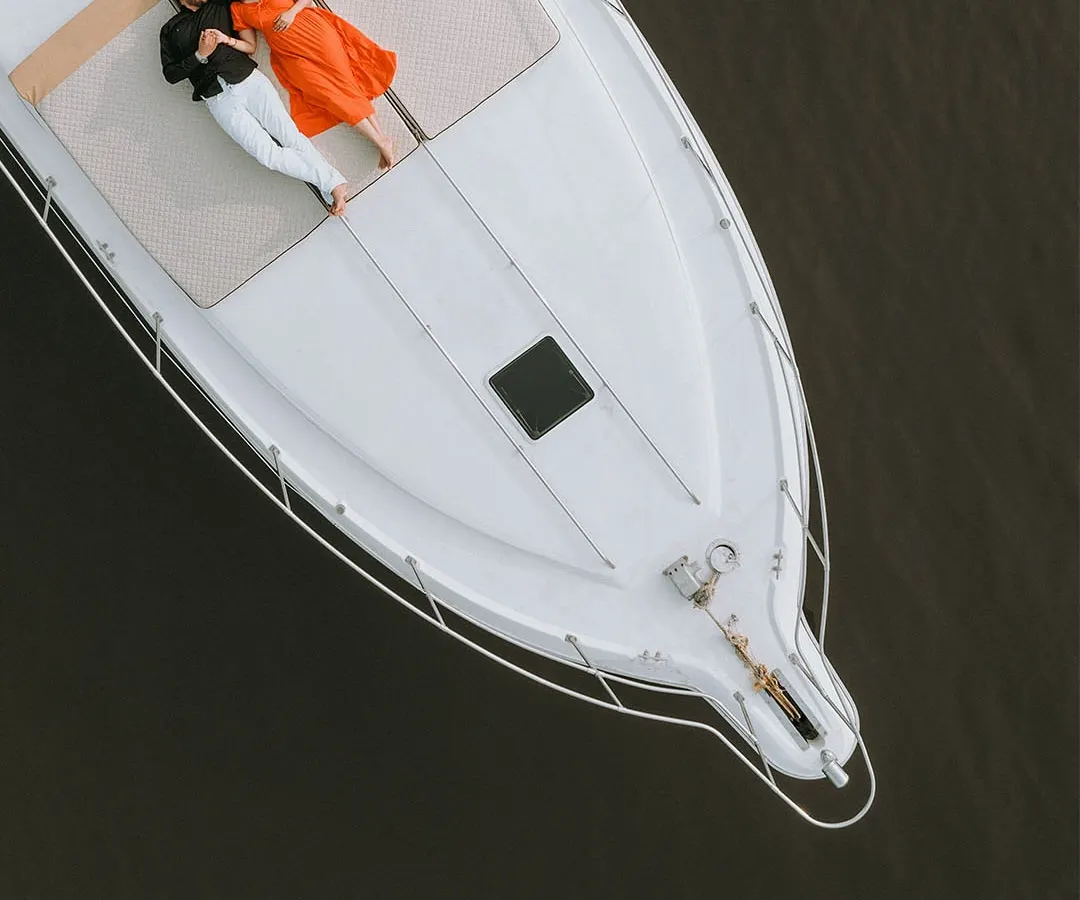 Pre-wedding shoots are about capturing your unique chemistry. This aerial shot from a yacht in Goa shows how I use grand perspectives to create intimate, aspirational portraits that feel both epic and personal.