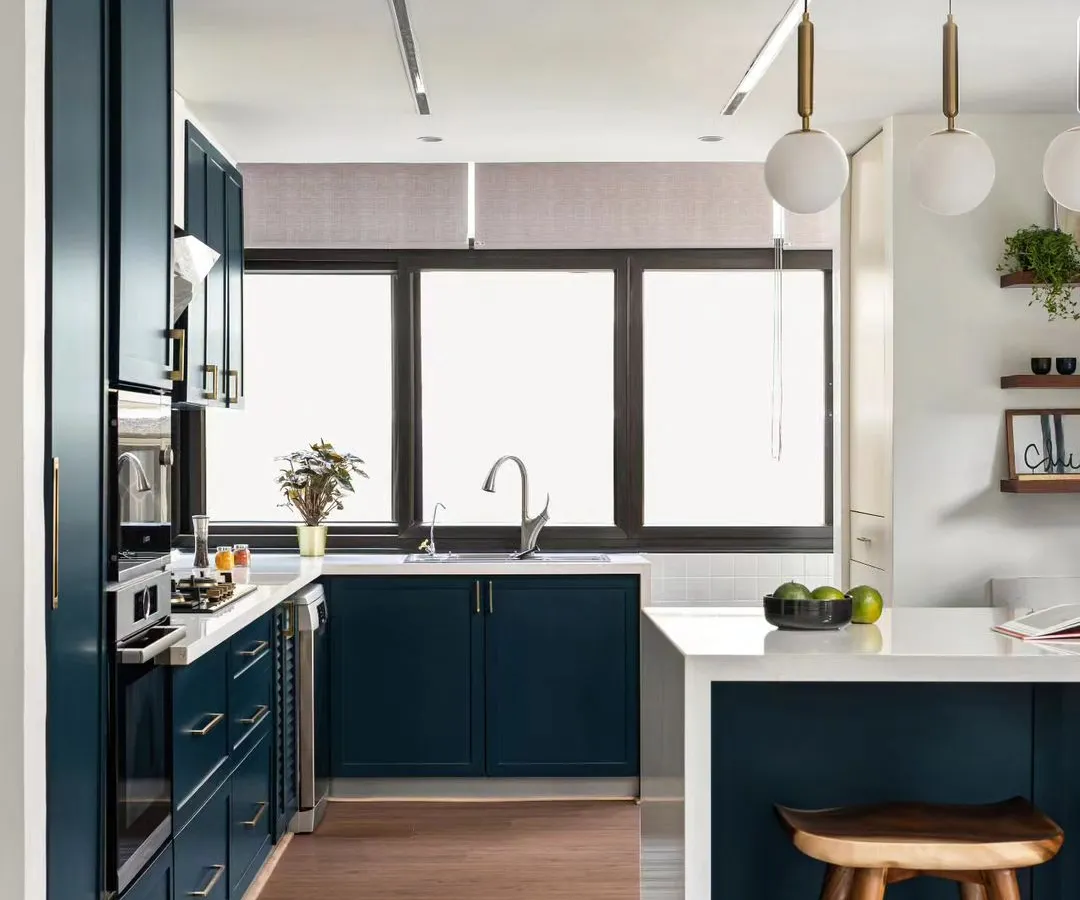 I love it when clients are open to using bold color. This deep blue kitchen has become a real centerpiece, proving that functional spaces can also be full of personality. We designed it with a breakfast bar for casual meals and smart storage to keep everything sleek and organized.