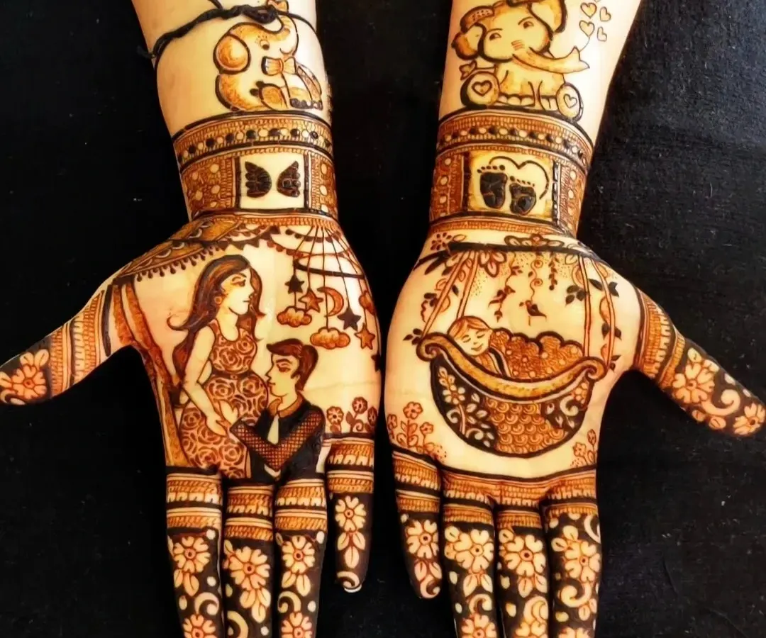 Celebrating a new beginning with special baby shower mehndi. This custom design includes portraits of the expecting parents, a baby in a cradle, and cute elephants, making it a unique and memorable part of the godh bharai ceremony.
