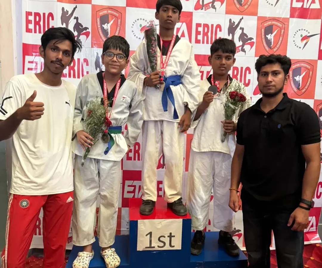 The result of dedication and hard work. I am proud to stand with my students on the winners' podium as they celebrate their achievements at a Taekwondo competition.