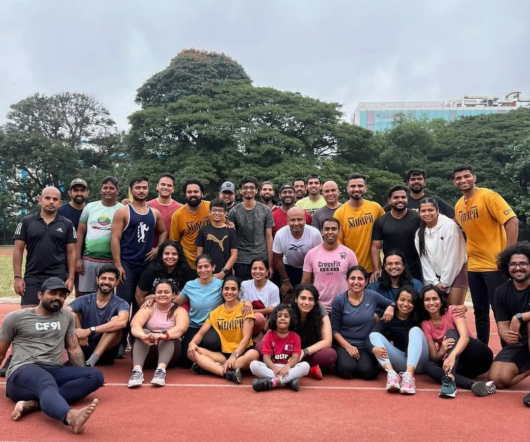 Our running community is strong. This is a shot of our group after a tough track workout. We believe in being stronger together, pushing each other to be better humans, not just better runners.