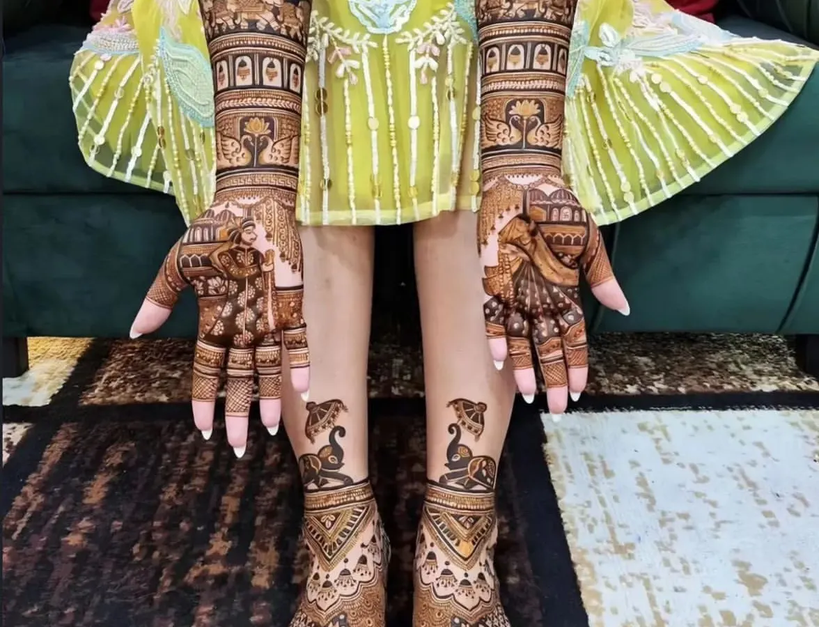 A complete bridal look is essential, which is why I coordinate the designs for both hands and feet. This set features matching traditional Rajasthani patterns with elephants and intricate details that flow from the arms down to the toes.