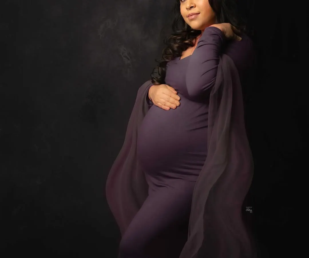 Celebrating the strength and radiance of motherhood. This mama-to-be shines in a dramatic, deep purple gown from my studio wardrobe, set against a rich, moody backdrop for a fine art feel.