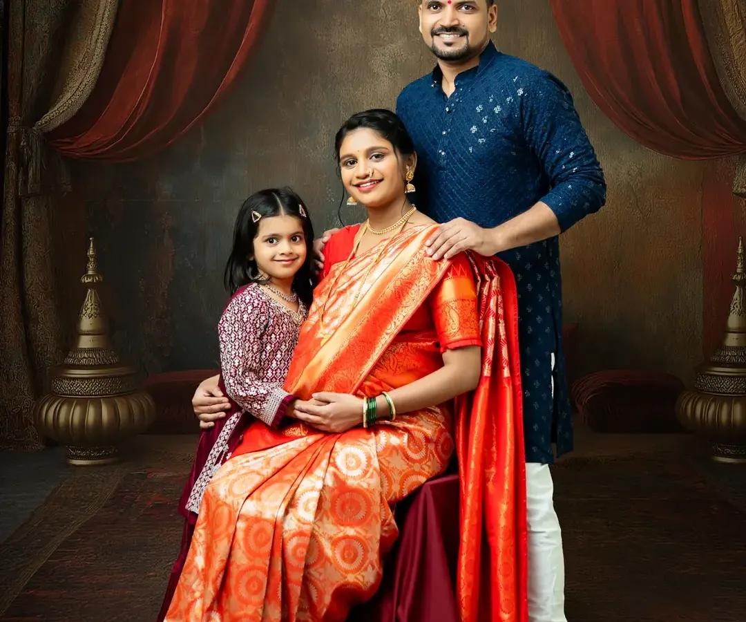 I love creating timeless family portraits that honor our culture. Here, the entire family comes together in traditional attire for a regal and warm maternity photo, celebrating the new life that will soon join them.
