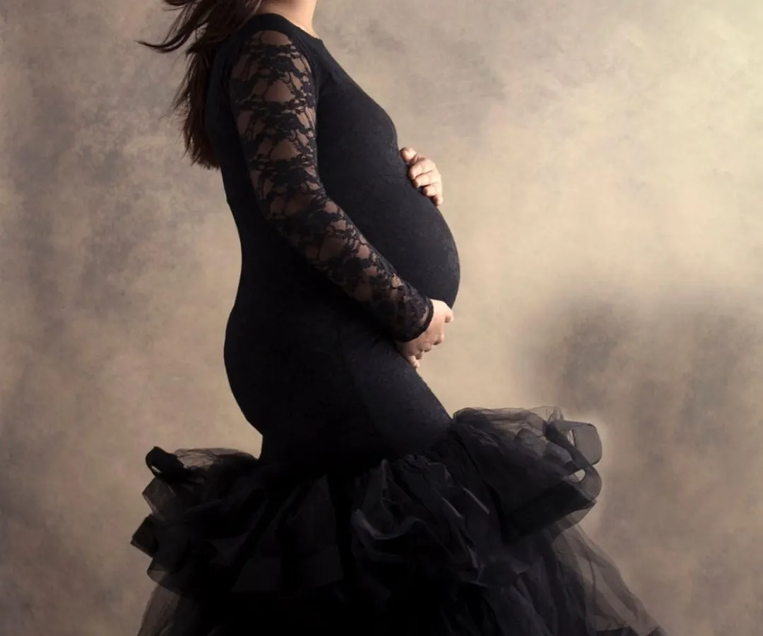 In the quiet of my studio, we can create powerful, fine-art portraits like this. The focus is entirely on you, your strength, and the beautiful shape of motherhood, captured in a classic, elegant style.
