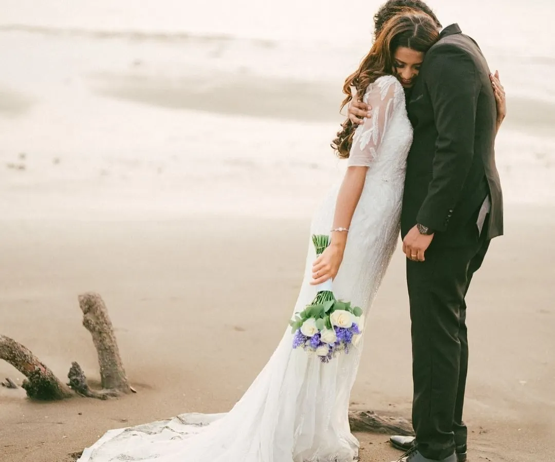 An intimate embrace on the shore, where the world fades away leaving just two people. This is the essence of our fine art style, capturing the quiet, powerful connection between a couple in a timeless, cinematic frame.