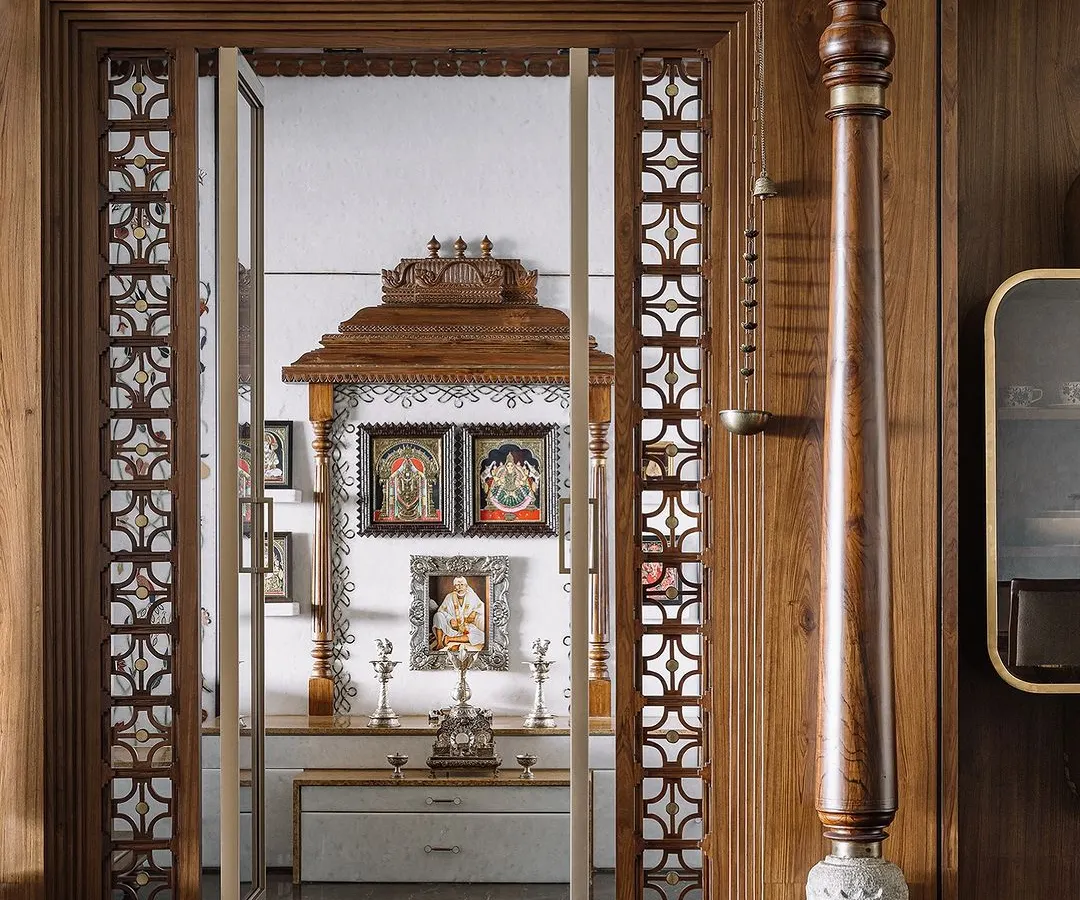 I believe a pooja room should be a sanctuary of peace. For this space, I drew inspiration from the grandeur of South Indian temples, using vintage pillars, custom jalli work, and a mantapa that echoes temple gopurams. It’s a celebration of tradition, crafted with intricate details to create a truly sacred heart for the home.