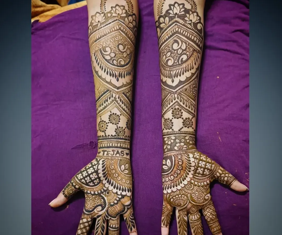 This is an example of my intricate full-arm mehandi work. The design features a mix of delicate paisleys, bold geometric bands, and fine line work, creating a stunning and balanced look perfect for any grand celebration.