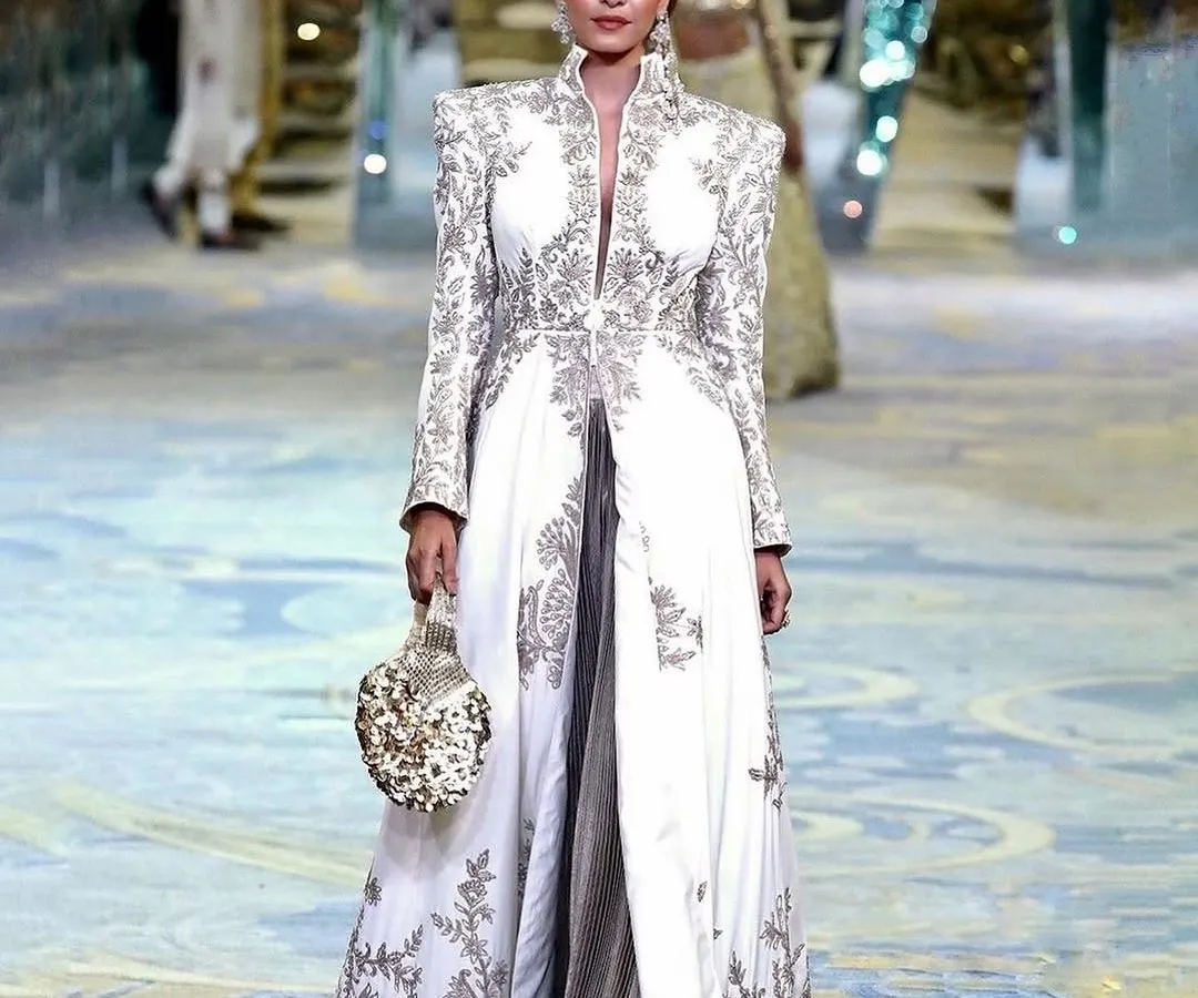 On the runway for the Manish Malhotra Bridal Couture Show. This look features glowing skin and defined eyes, designed to be impactful from a distance and under bright runway lights.