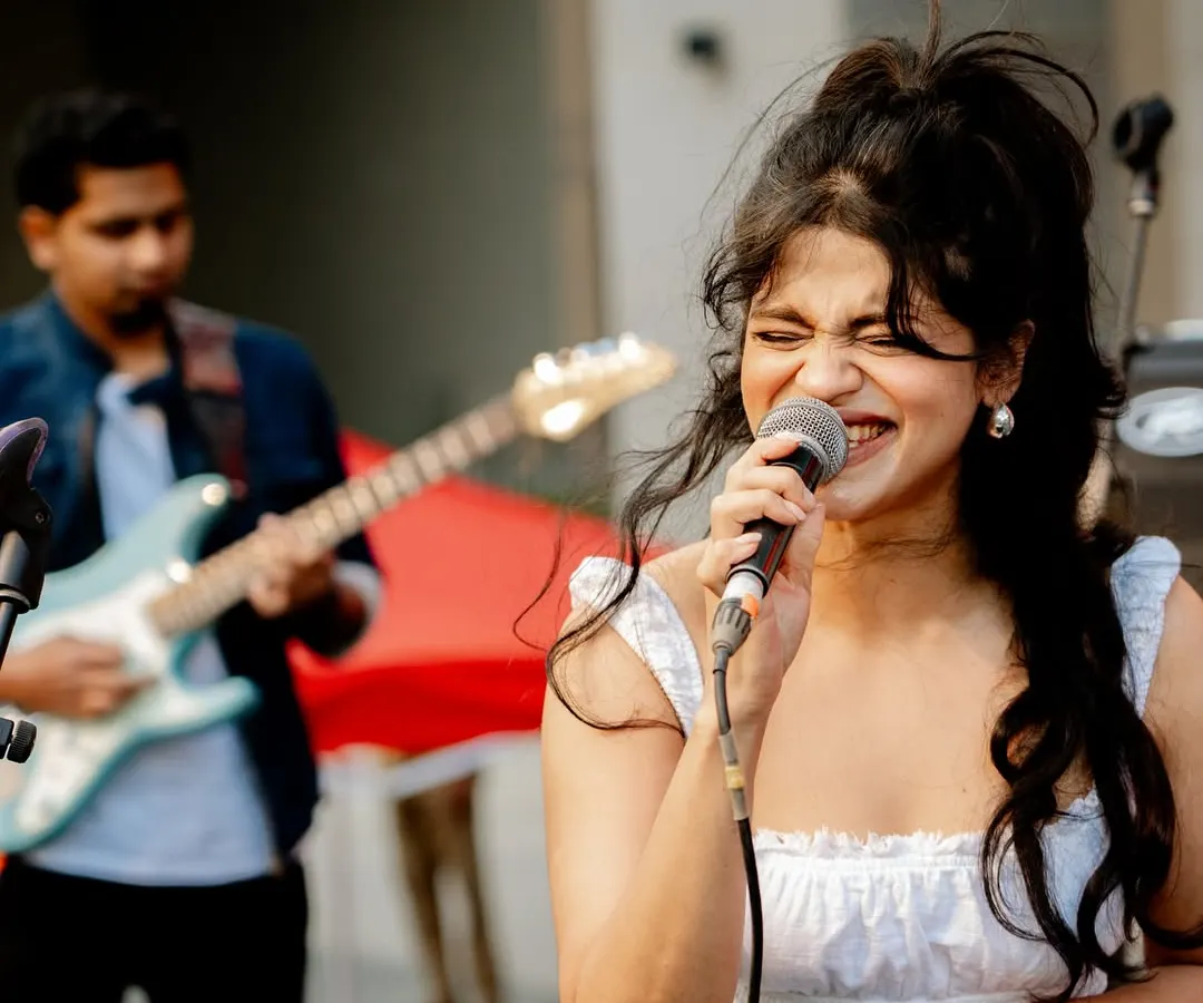 Feeling the music during a live duo performance with my guitarist. This was an incredible moment for me, opening for the band Swarathma at a large outdoor festival.