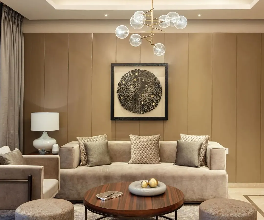 We believe a living room should feel personal and timeless. In this space, we layered textures and neutral tones with carefully chosen art and lighting to create an atmosphere of quiet sophistication. The design invites you to linger, to have conversations, and to feel completely at ease.