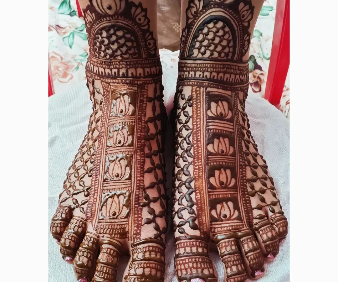 A close-up of my bridal feet mehendi work. This design features repeating lotus motifs, a symbol of purity and beauty, set within a grid pattern that covers the entire foot for a complete and elegant look.