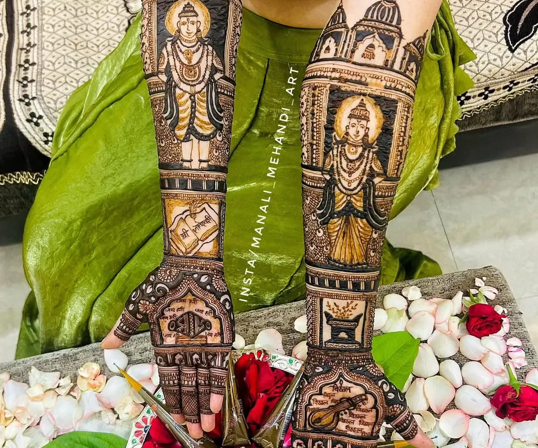 For this bride, I created a spiritual design featuring portraits of the deities Vitthal and Rukmini. The artwork is framed by temple-style architecture and includes a veena motif, all done with fine lines for a divine look.