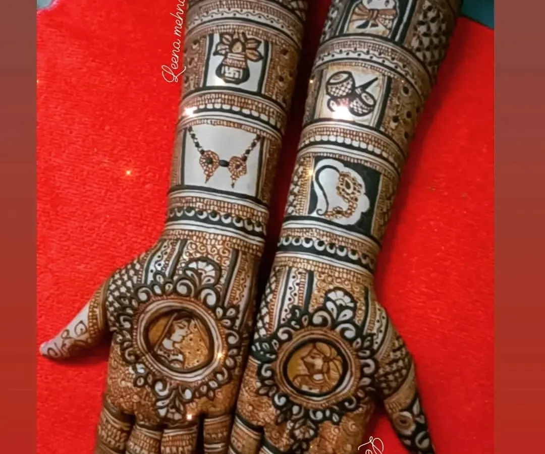 A complete bridal story told on the hands. This design features detailed portraits of the couple, surrounded by traditional wedding symbols like Lord Ganesha, a doli, shehnai, and kalash, making it a true narrative piece.