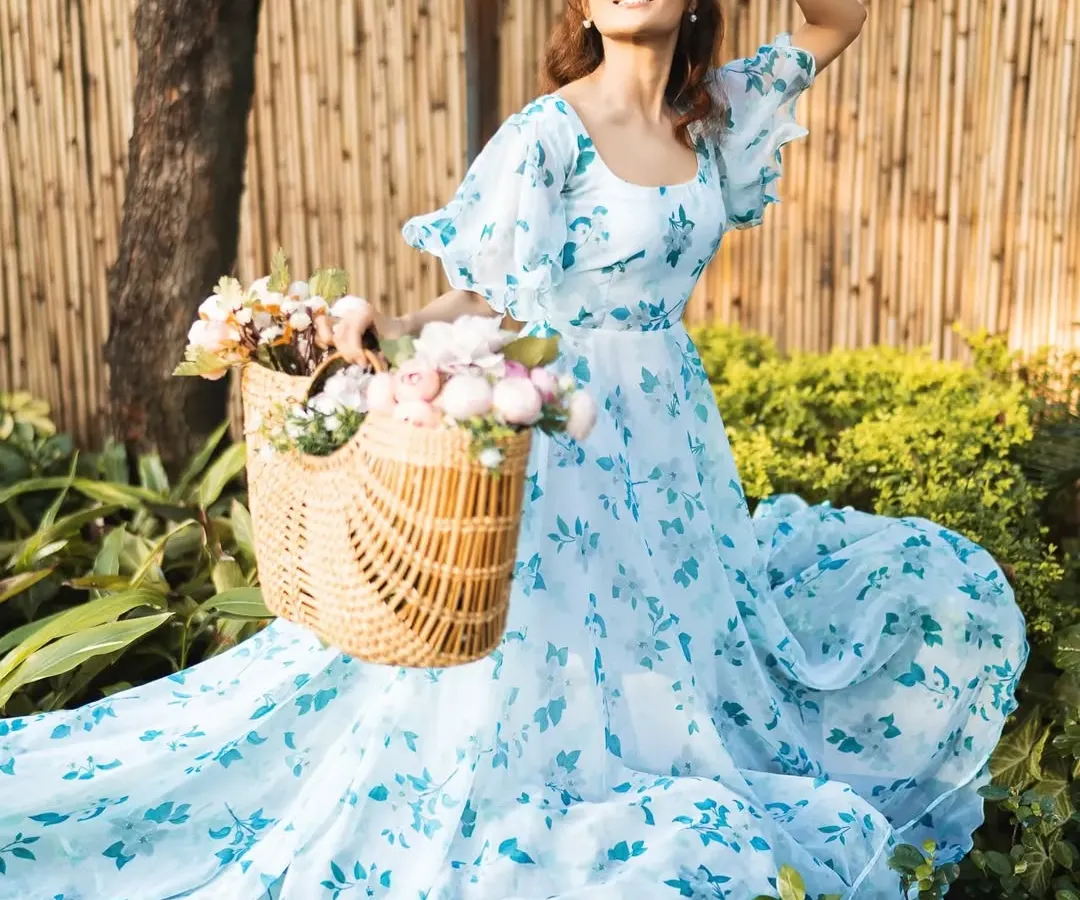 A shot from an outdoor fashion campaign, capturing the movement and elegance of the dress in natural light. I aim for a soft, cinematic feel in my lifestyle shoots, creating images that are both beautiful and commercially appealing.