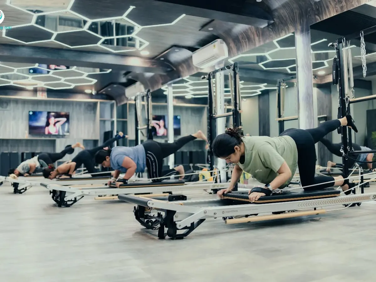 The energy in our group Reformer classes is motivating. Here, clients are synchronized in a leg and core exercise, building strength together while maintaining individual focus and form.