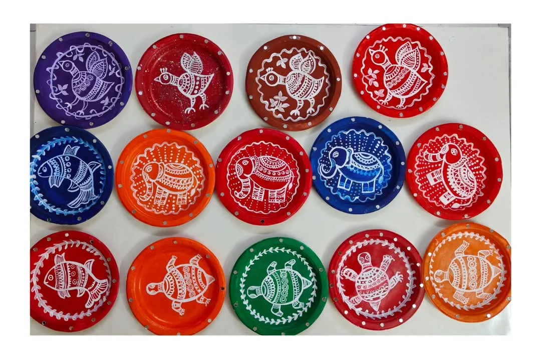 Look at these vibrant Mandala-style paintings on plates, a favorite activity from our summer camp. We teach traditional art forms in a fun, accessible way, letting each child add their own unique touch.
