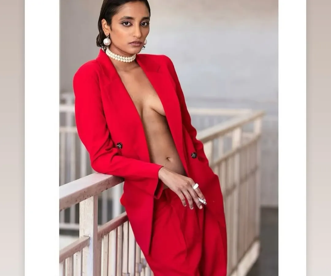 I believe every person deserves to have a portrait that makes them feel powerful and seen. This magazine-style photoshoot is designed to be a transformative experience, capturing your unique essence in a bold, artistic way. Here, the striking red suit and confident pose create a truly unforgettable image.