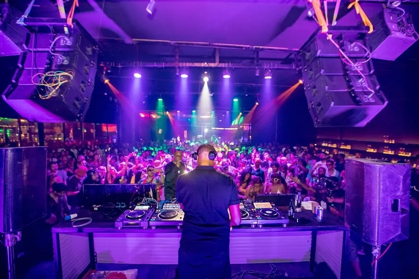 From behind the decks at Goa Sunsplash, looking out at a sea of people. This is my element, controlling the energy of a massive festival crowd and taking them on a journey through sound.