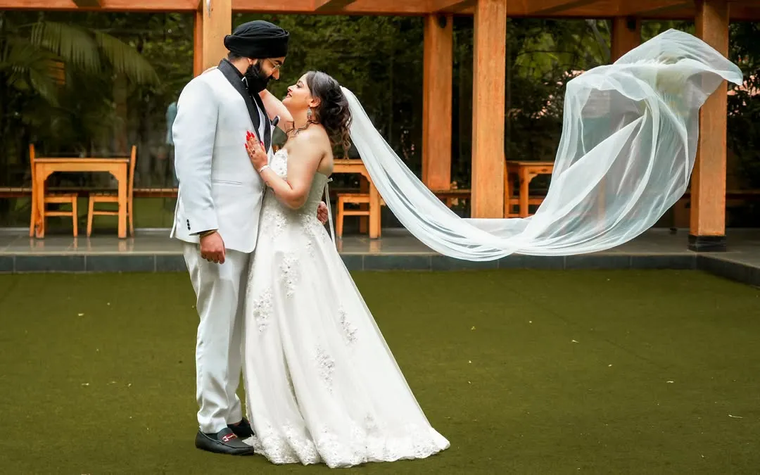 Capturing the magic in simplicity. We love using elements like a bride's veil to create soft, romantic, and timeless portraits that feel both elegant and natural. This shot was taken in a beautiful resort corridor in Bangalore.