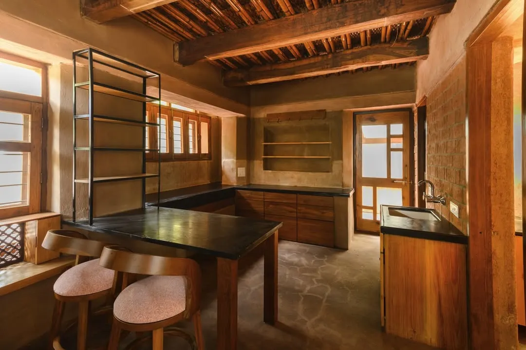 The kitchen is often the heart of a home, and this one was a joy to photograph. I focused on the interplay between the dark countertops, the warm wooden cabinetry, and the soft light from the windows. It’s a space that feels both functional and deeply inviting.