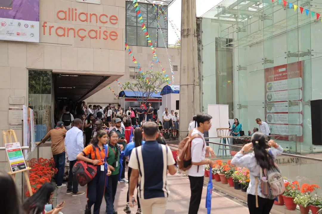 The entrance to our campus buzzing with energy during the annual Francophonie Mela. Students, families, and visitors gather, showing the scale and excitement of our cultural celebrations. It's a perfect example of the community spirit we foster.