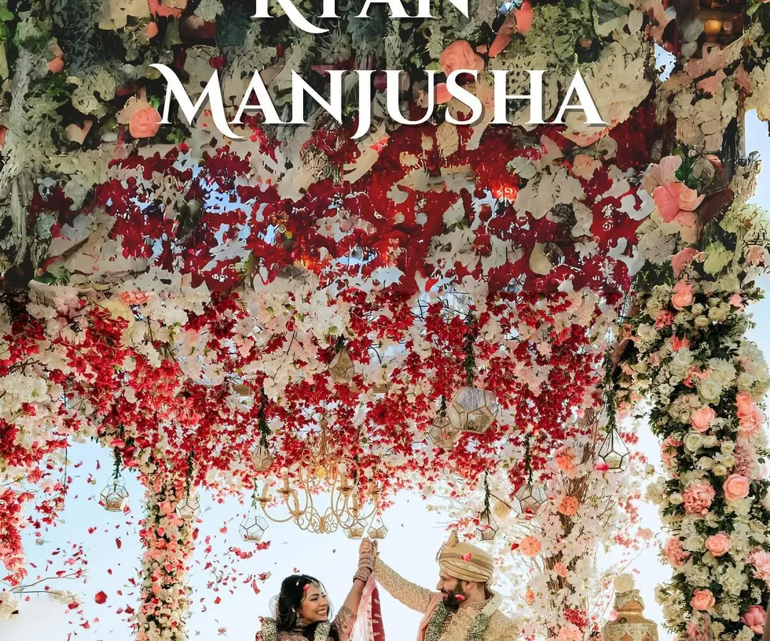 This is the moment every story builds towards. A spectacular shower of petals rains down on the couple during their beachside varmala ceremony, creating an unforgettable, epic frame against the ocean backdrop.