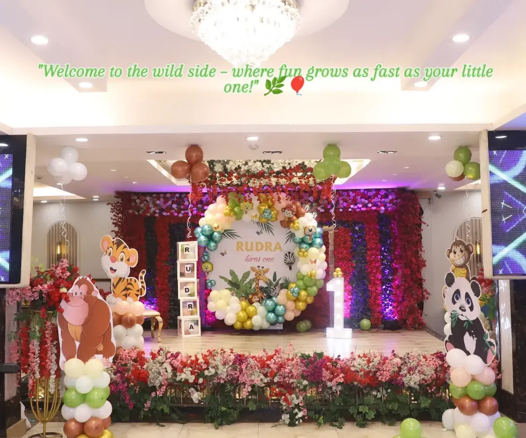 Welcome to the wild side! This grand jungle-themed setup for a first birthday party shows how I can transform a large venue into an immersive experience. With a custom backdrop, vibrant balloon arrangements, and adorable animal cutouts, I create a playful safari adventure for the little ones.