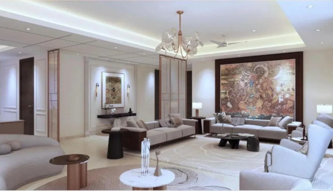 An expansive view of a modern 4BHK apartment living room at Platinum Tower, Gurgaon. This full interior renovation features a neutral color palette, statement art, and layered lighting to create a sophisticated and welcoming space.
