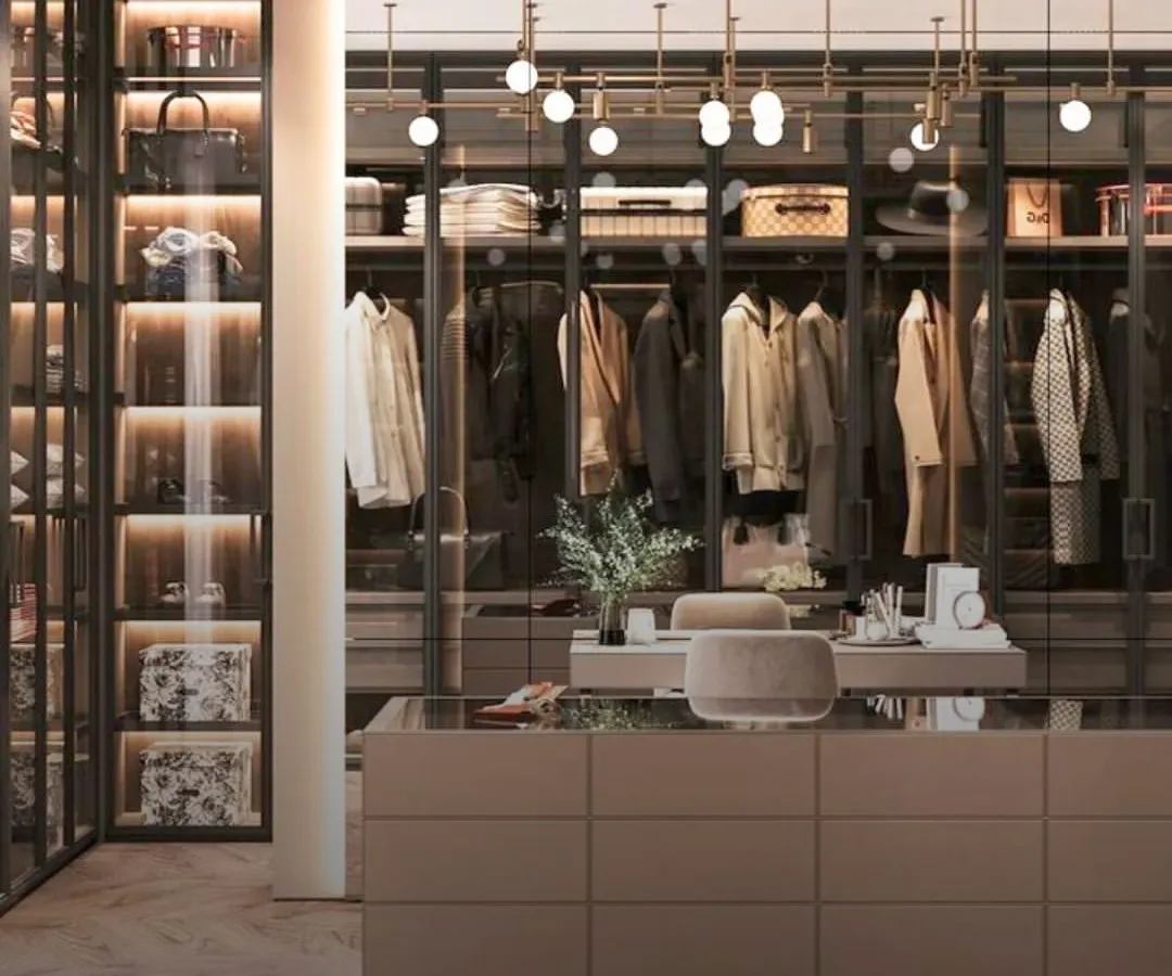 This is the dream walk-in closet, realized. We designed this space with a central island for accessories, glass-fronted displays for statement pieces, and custom lighting to create a boutique-like experience right in your home.