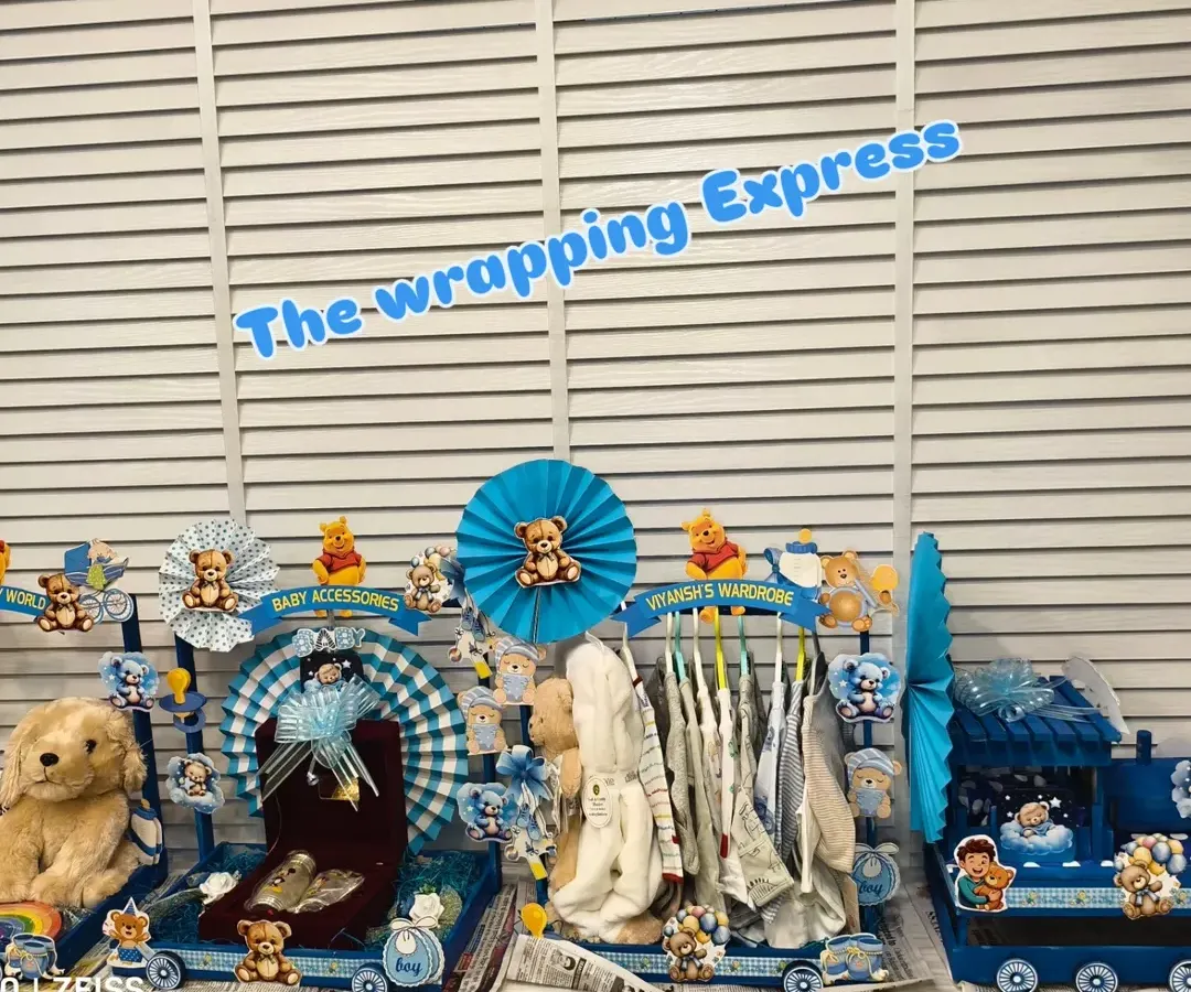 My 'Big Brother Express' train is a very popular gift for welcoming a new baby. This large, multi-cart setup includes separate sections for clothes, toys, accessories, and even a special silver gift set.