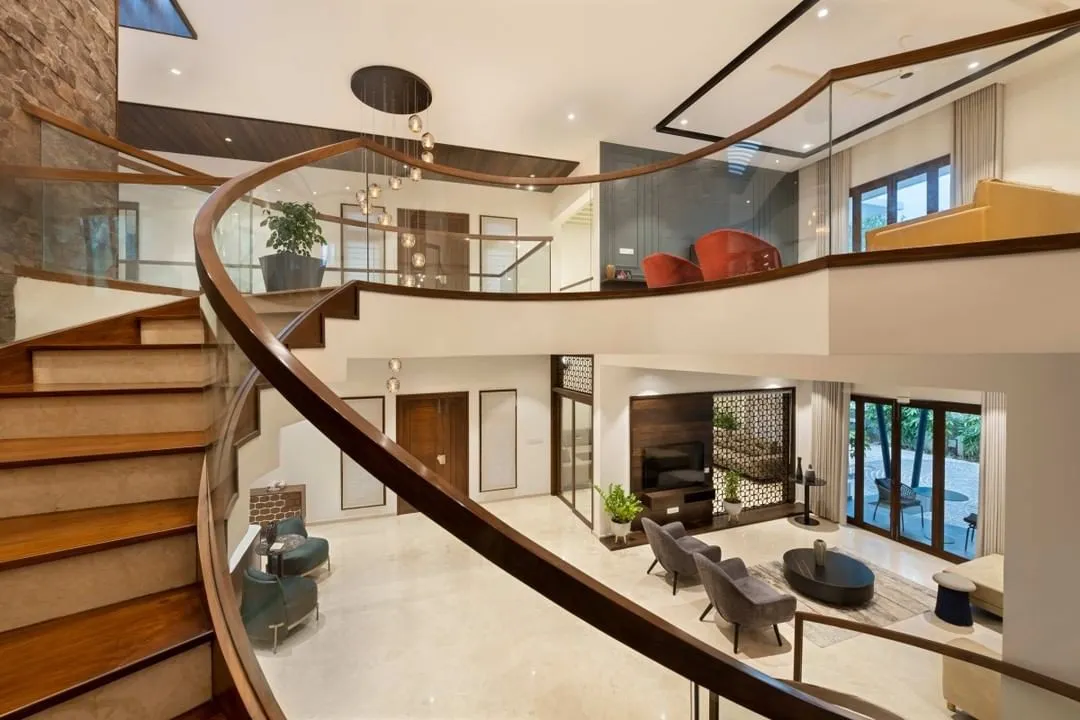I love creating dramatic moments in a home. This sweeping, curved staircase isn't just for getting from one floor to another; it's a sculptural centerpiece that connects the entire living space and offers stunning views from every angle.