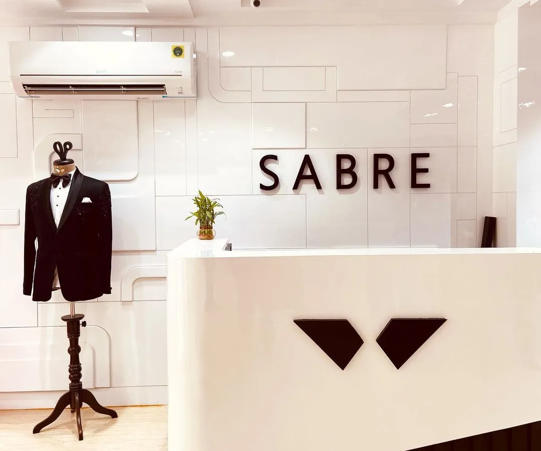 Welcome to the Sabre studio, where your bespoke journey begins. Our modern and minimalist space is designed for your comfort as we discuss your vision during the initial consultation. This is where we translate your personal style into impeccably tailored garments with the highest attention to detail.