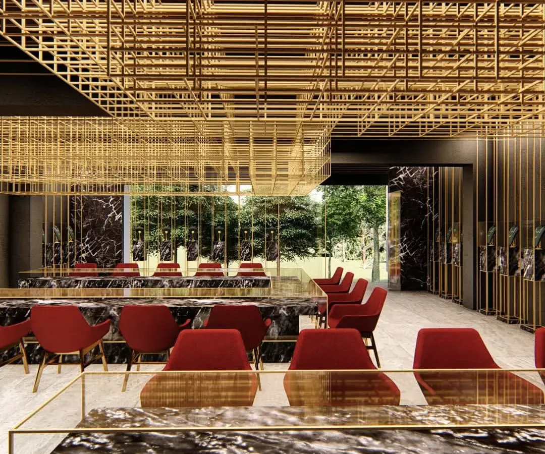 For this Lucknow jewellery showroom, we designed a suspended brass mesh that defines the space and functions as a dramatic lighting installation, contrasting with dark marble and bold red accents.