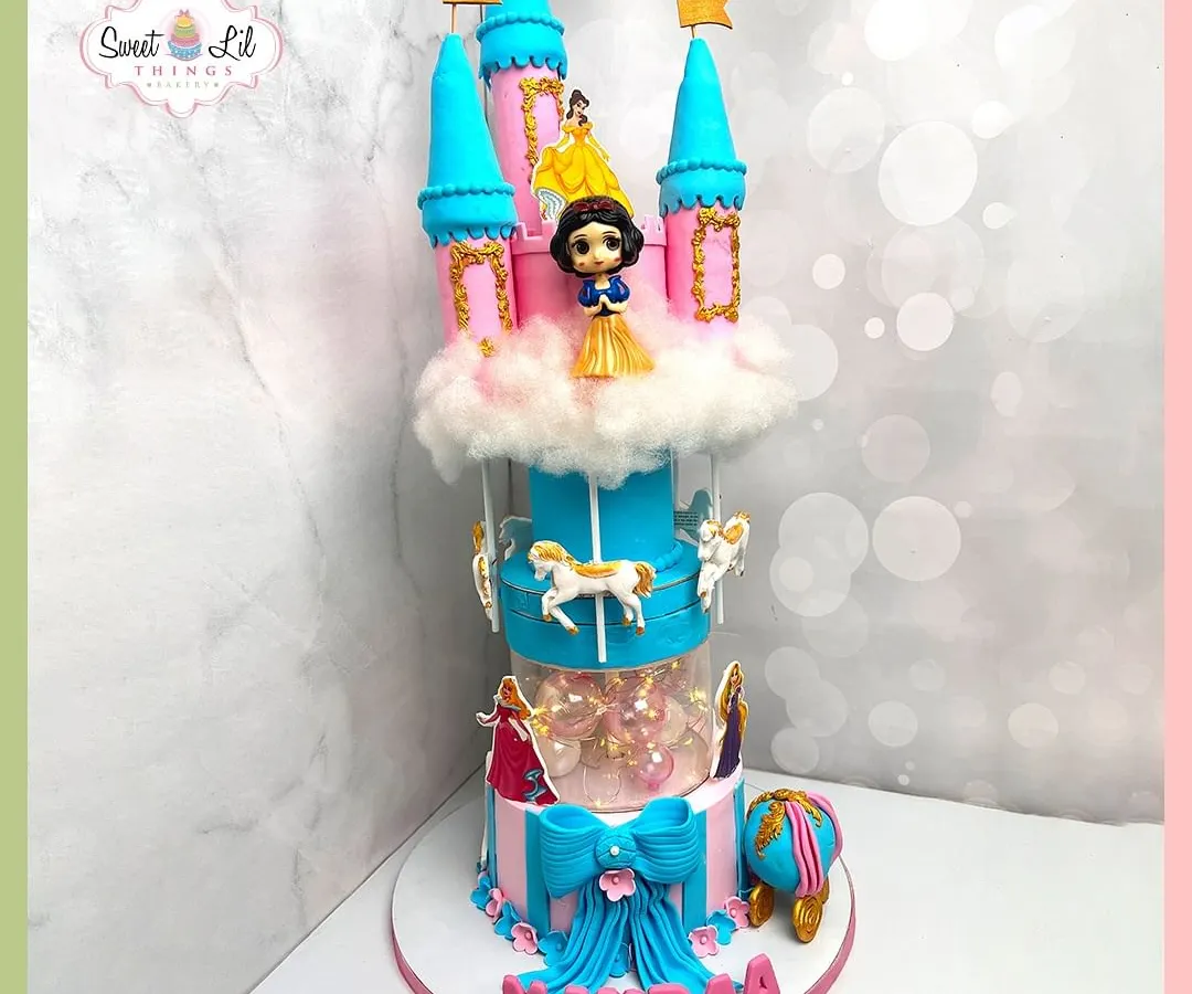We bring fairy tales to life with this magnificent multi-tiered princess castle cake, complete with a rotating carousel. Featuring beloved princesses and intricate details, this is the kind of magical centerpiece that makes a child's birthday dream come true.