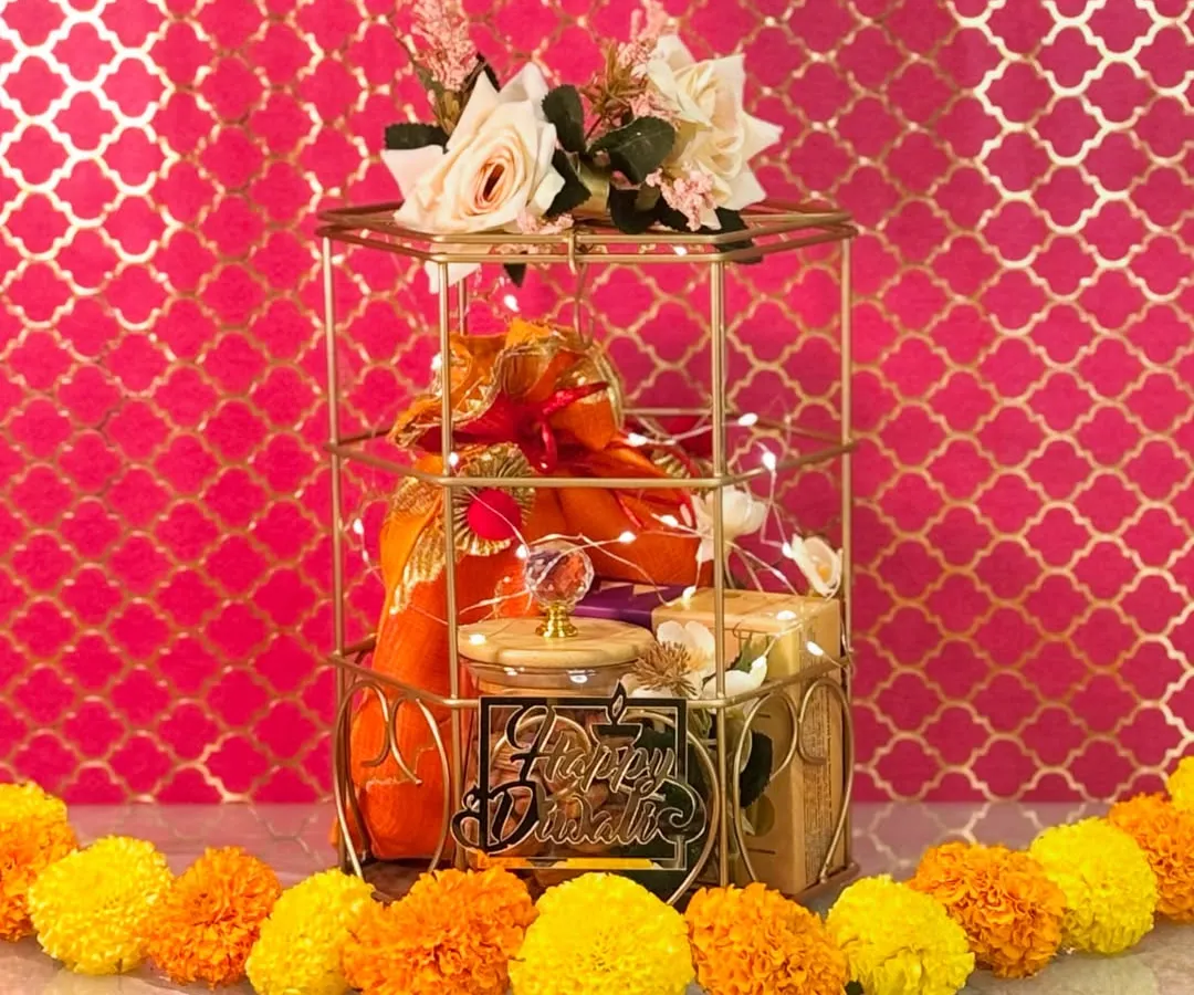 I believe a gift should be an experience. This regal gold cage hamper, filled with gourmet treats and aromatic essentials, is perfect for Diwali, weddings, or any grand celebration where you want to leave a lasting impression.